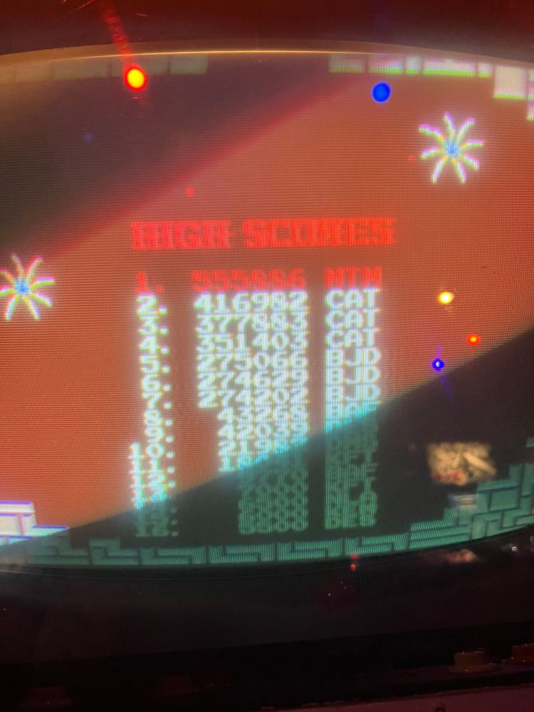 picture of an atari tetris cabinet, showing the high score list, in which I just got the 1st place score of 555,886 points