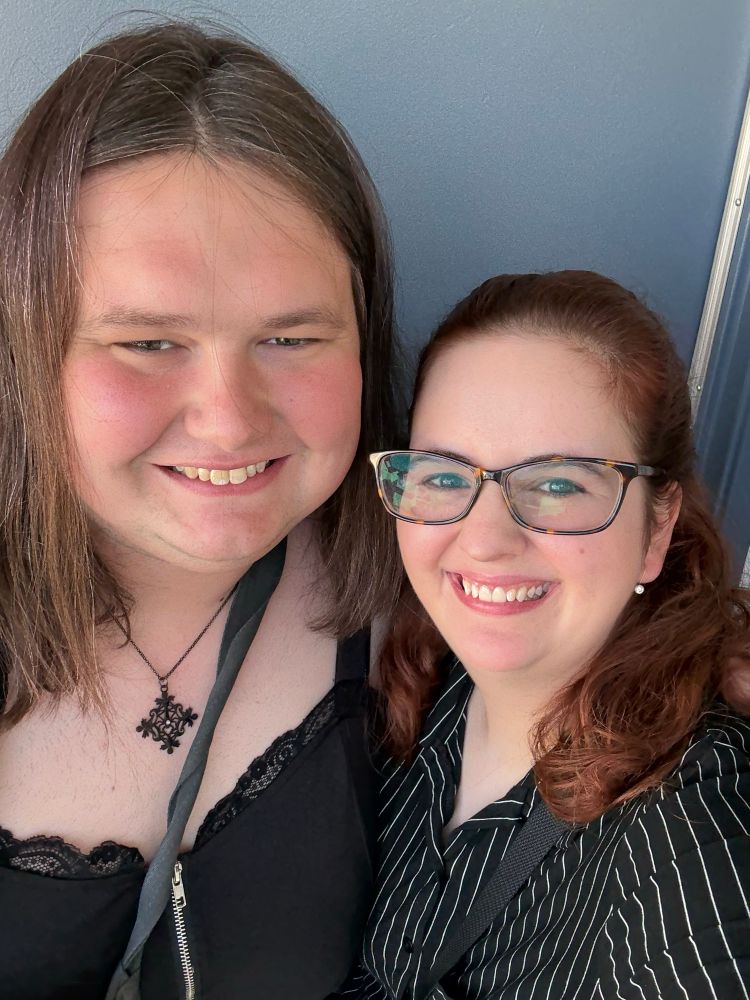 Two women dressed in black and looking scary cute