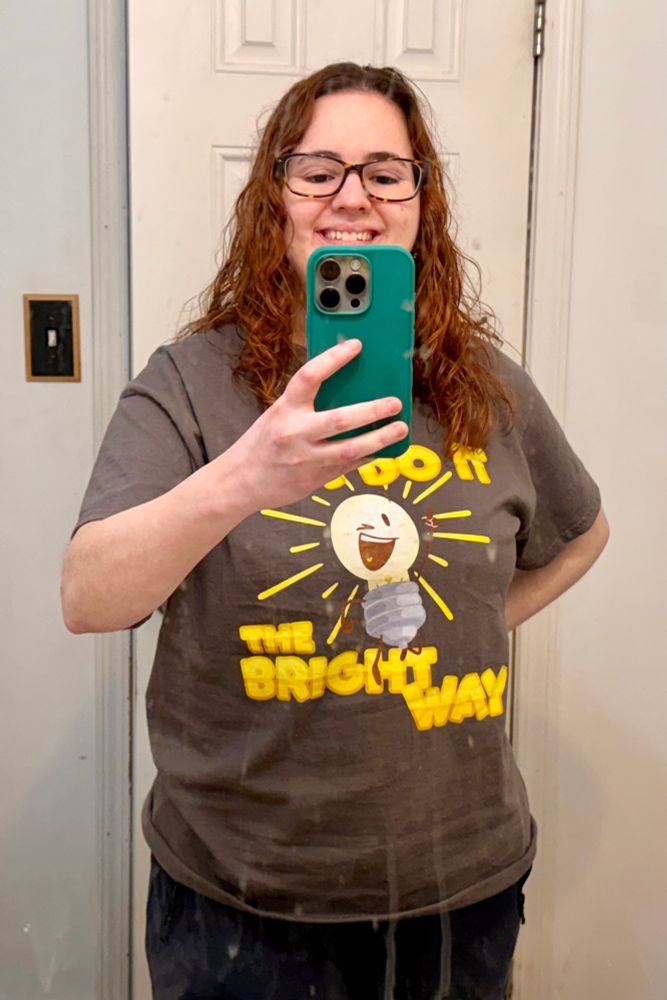 Brunette person with a Lightbulb t-shirt.
“Let’s do it the Bright way!”