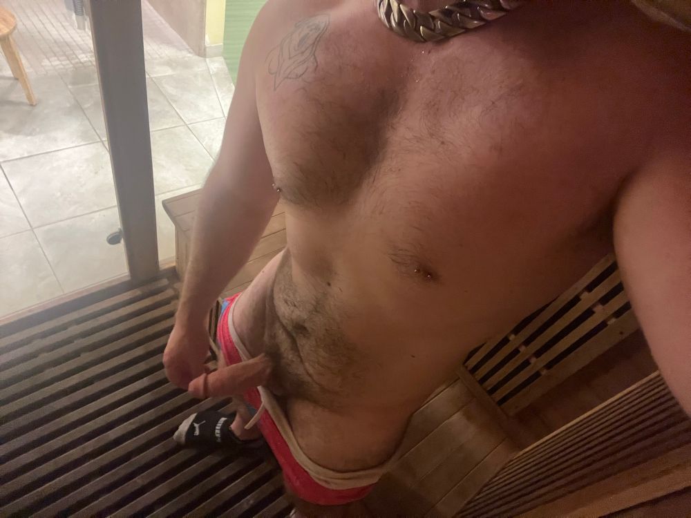 person standing nude in a gym sauna