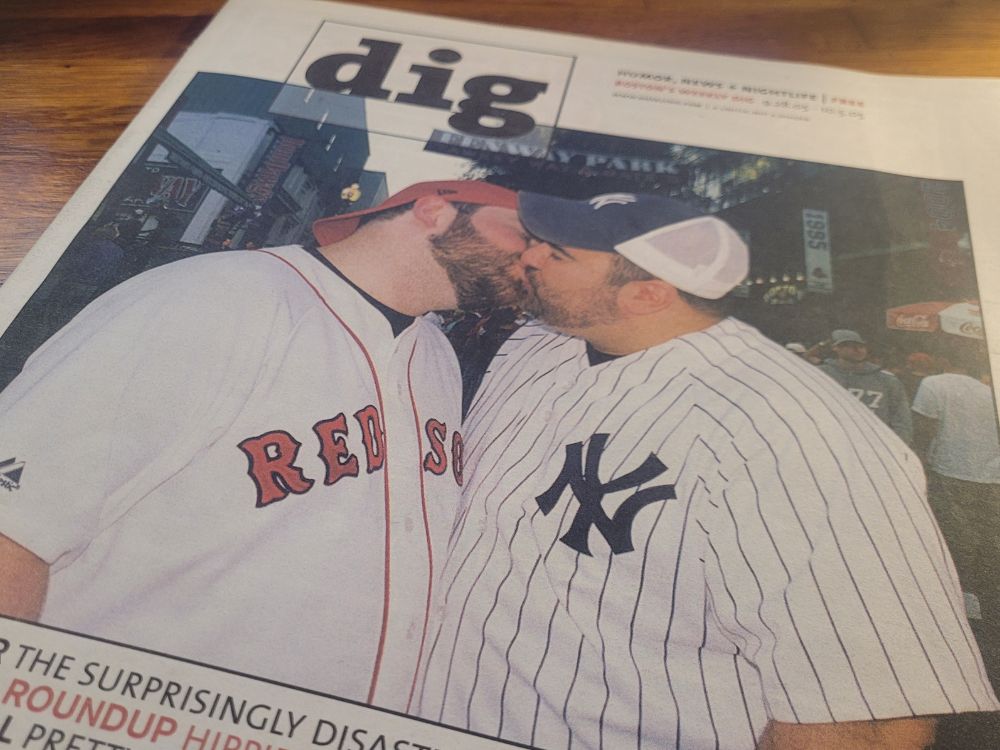 two big boys having a nice time at the ballgame 