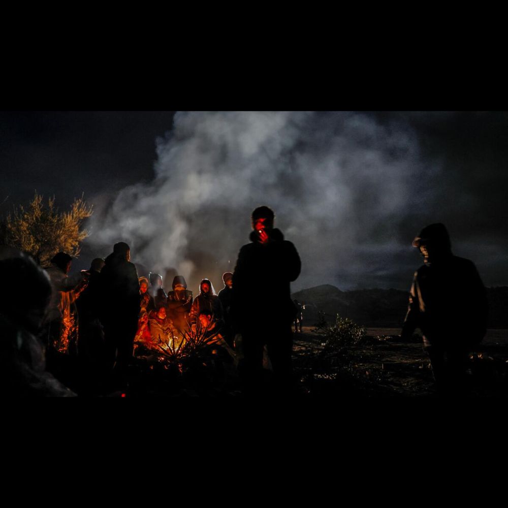 Migrants struggle against the elements in San Diego's open-air desert camps