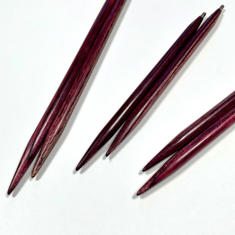 Three pairs of Darn Pretty™ interchangeable knitting needles in Orchid. Hand made in Chester, Vermont of dyed, laminated US Birch. www.dyakcraft.com