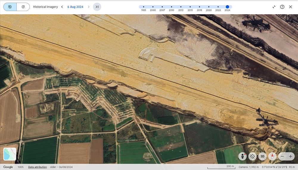 Same view, most recent aerial photo from Aug 2024, of the Garzweiler surface mine strip-pits over the former site of the village
