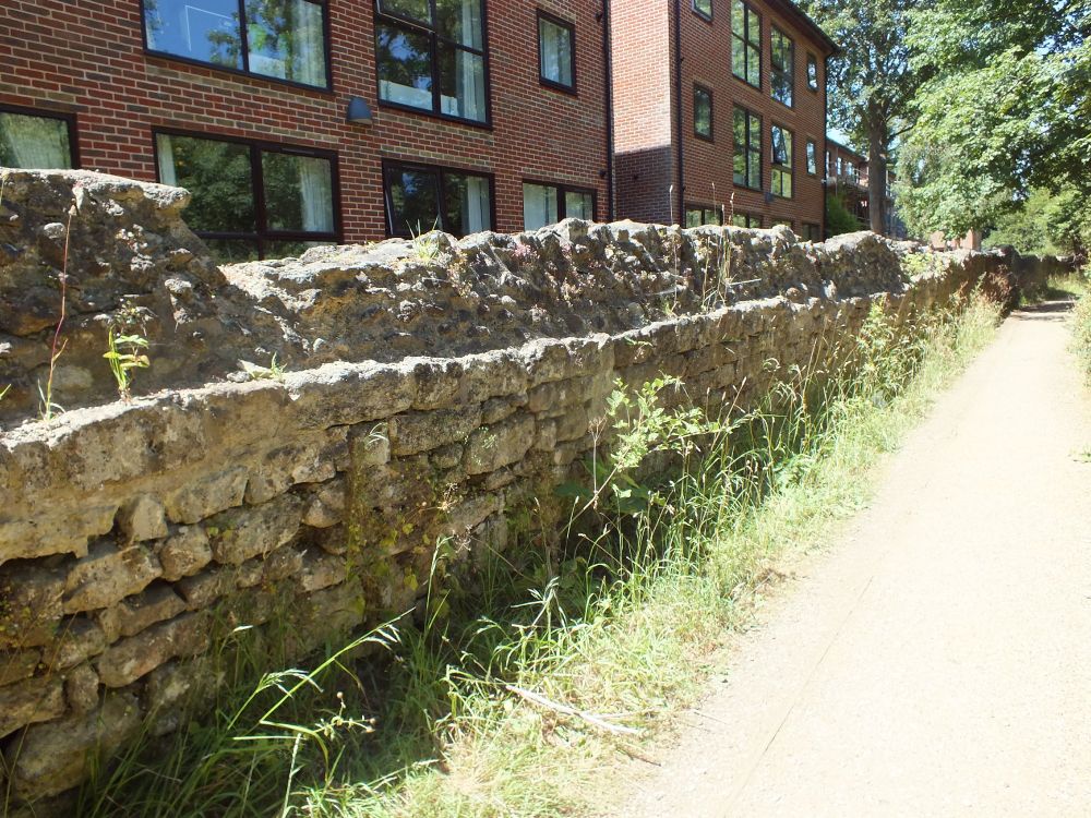 E precinct wall of dressed rubble leading up the gate
