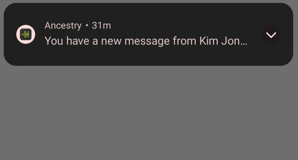 Screenshot of a phone notification from Ancestry. It says "You have a new message from Kim Jon..."