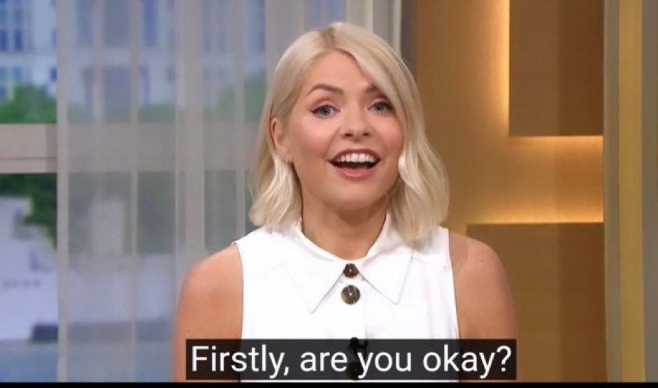 Screenshot of Holly Willoughby on 'This Morning' speaking to camera. The subtitle says "Firstly, are you okay?"
