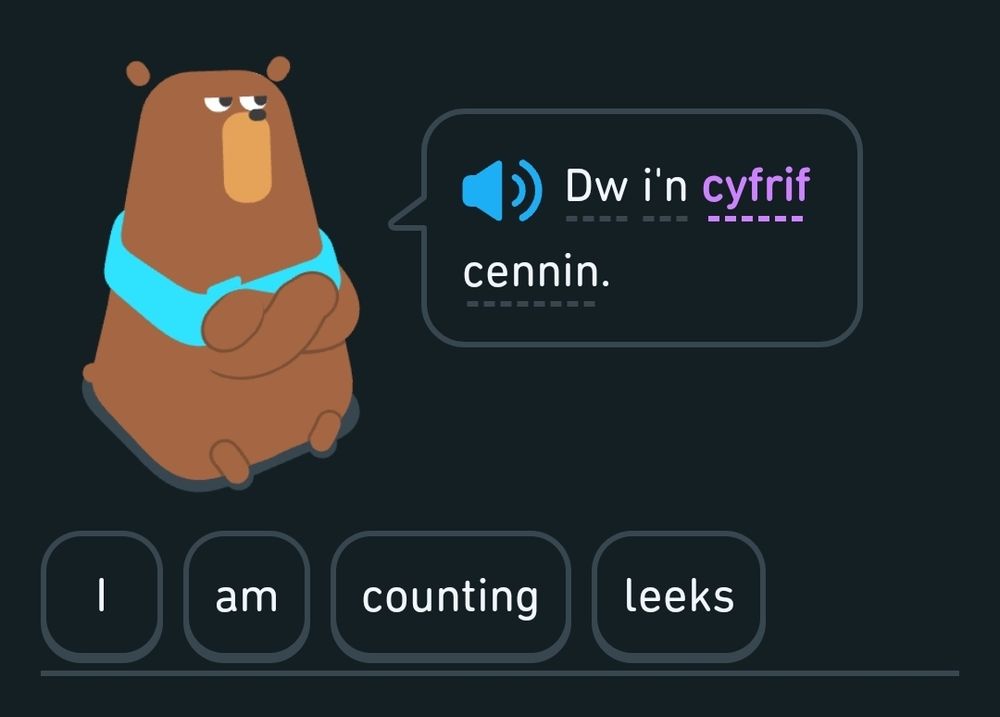 Screenshot from Duolingo showing the Welsh sentence "DW i'n cyfrif cennin" and the translation below of "I am counting leeks"