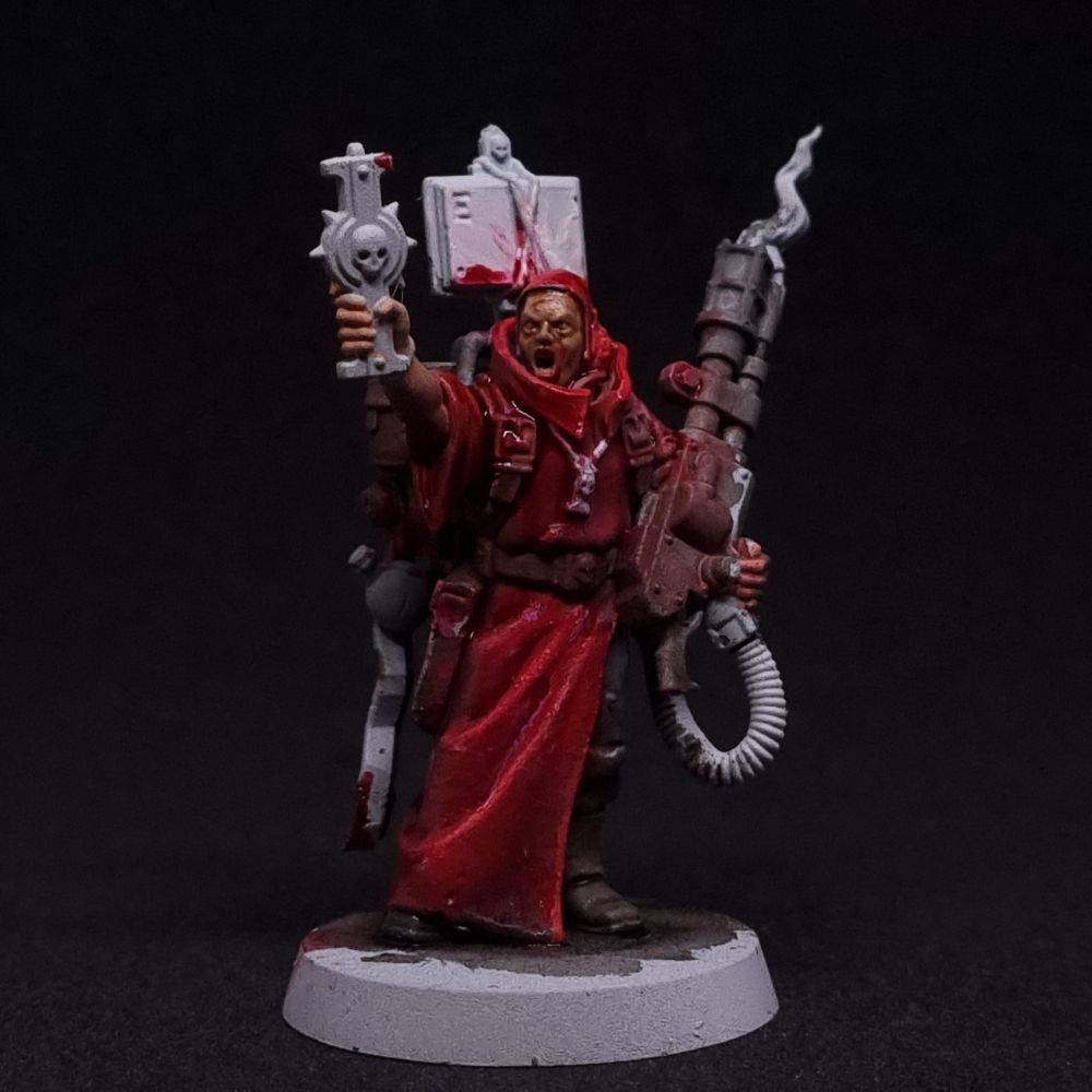 An acolyte with a flame thrower.