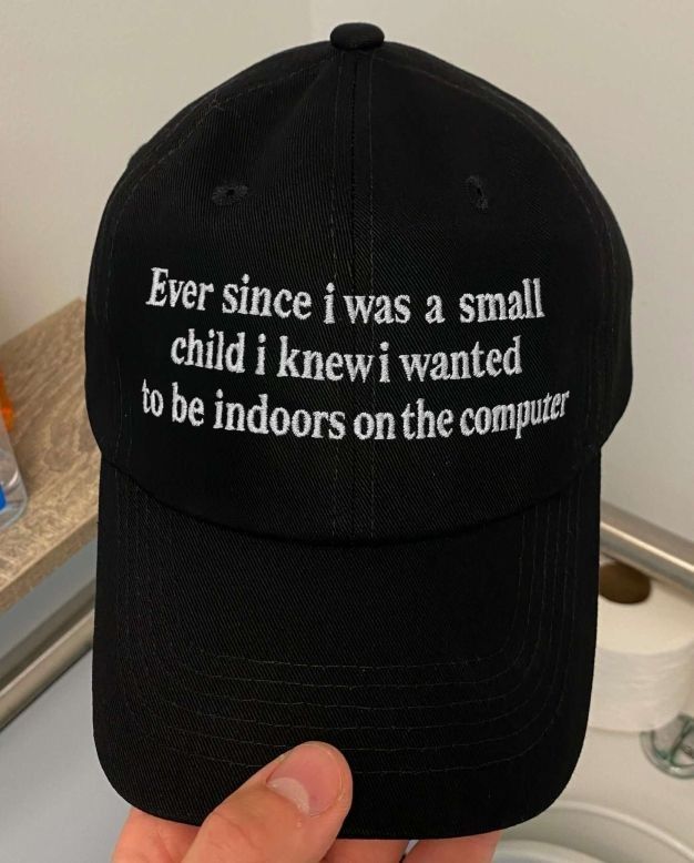 a hat with embroidered text: 