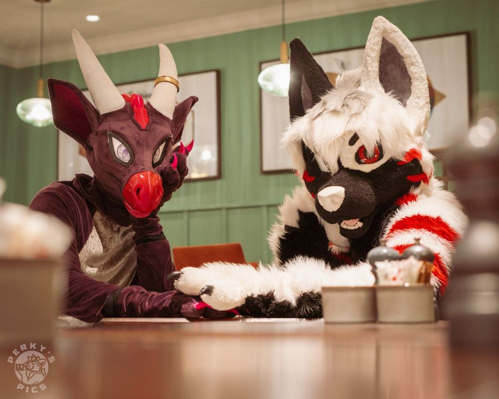 Dov and Ryan at a cafe looking at the camera