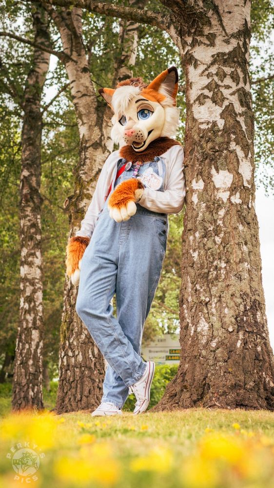 Lucas leaning against a tree
