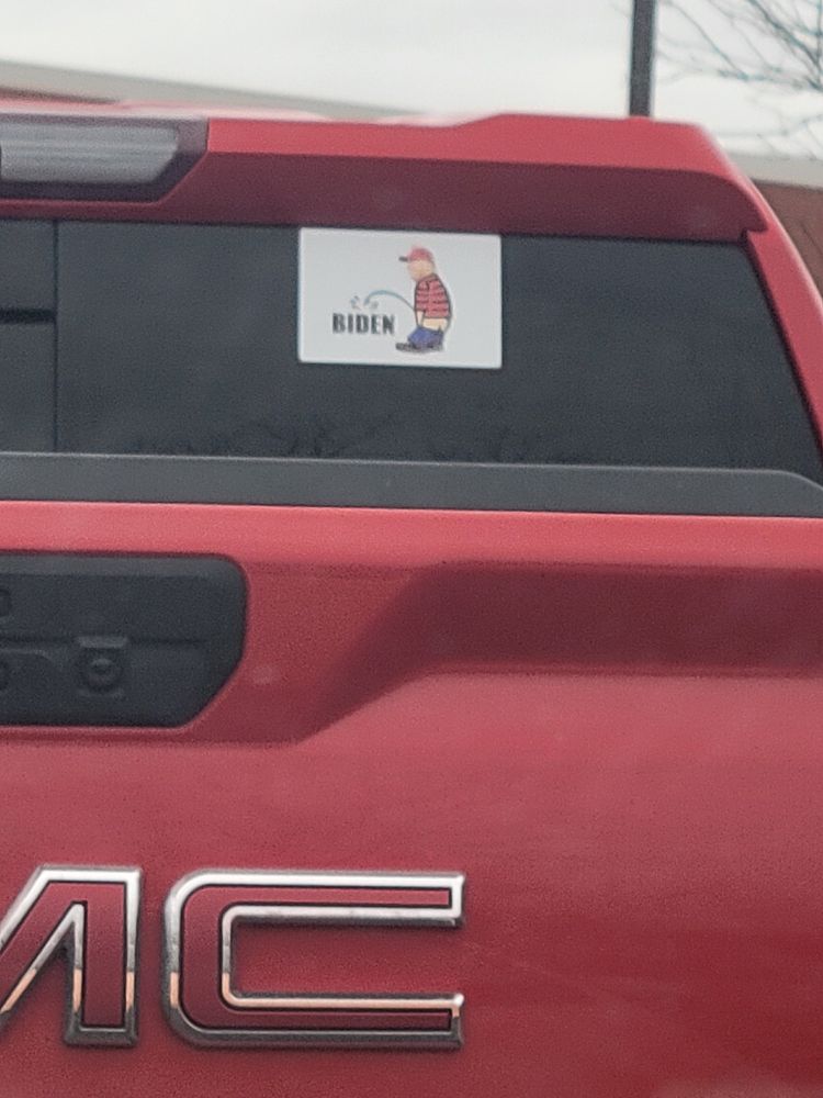 A bumper sticker I saw while dropping my kid off at school today. The sticker shows Donald Trump with his pants down peeing on Biden's name. I'm aware that this is boomer pee humor. It's also a kink activity that's been growing in popularity.