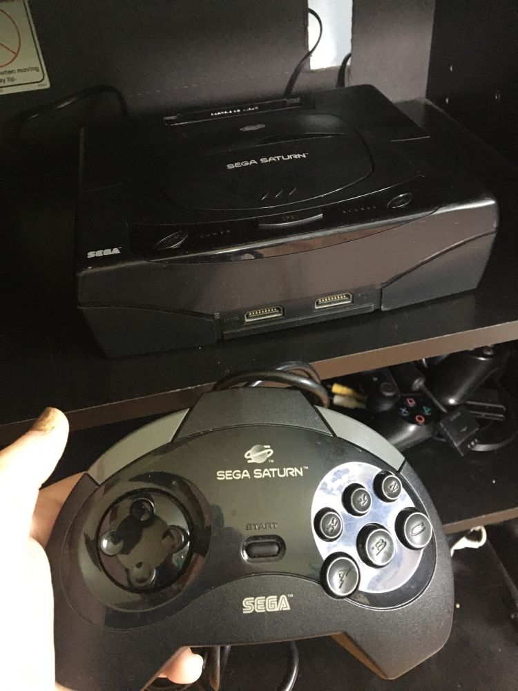 photo of a recently acquired Sega Saturn + controller. It is not entirely set up yet 😔