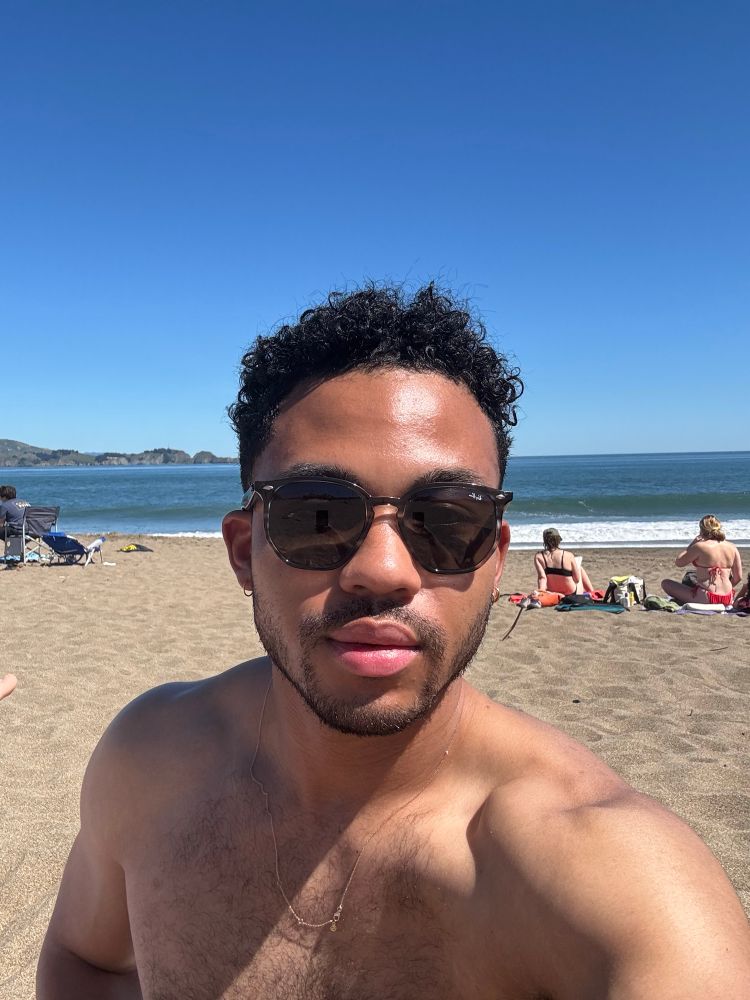 selfie with ocean in the back 