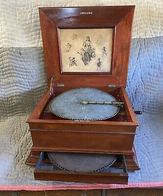 A music box with interchangable round disks