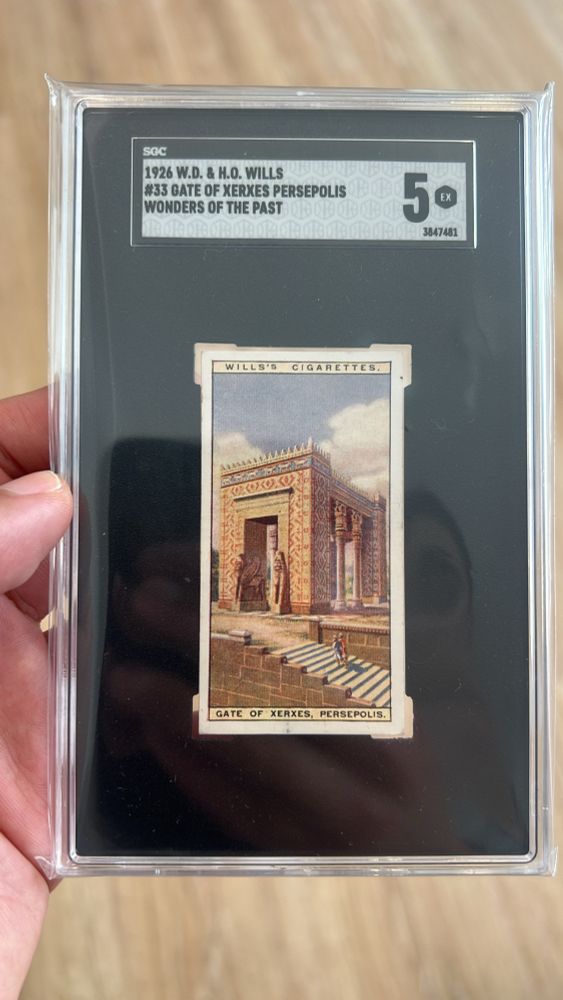 A promotional card produced by the W.D. & H.O. Wills tobacco company depicting the Gate of Xerxes in Persepolis. The card is in a graded holder, and was given the grade of 5 by SGC. 