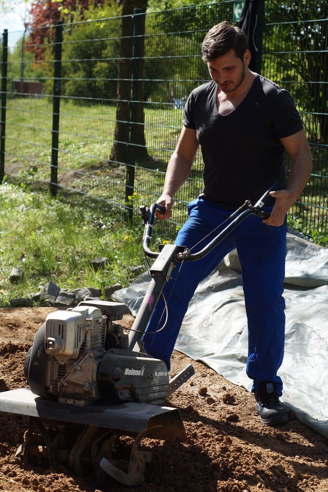 use of a tiller to make the earth easier to move into the formwork