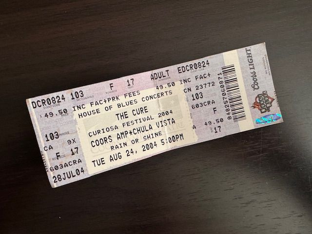 Purple and white ticket stub for The Cure’s Aug 24, 2004 San Diego concert. 