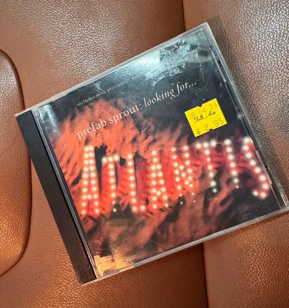 A CD jewel case for Prefab Sprout’s “Looking for Atlantis” lies of a. Town leather car seat 