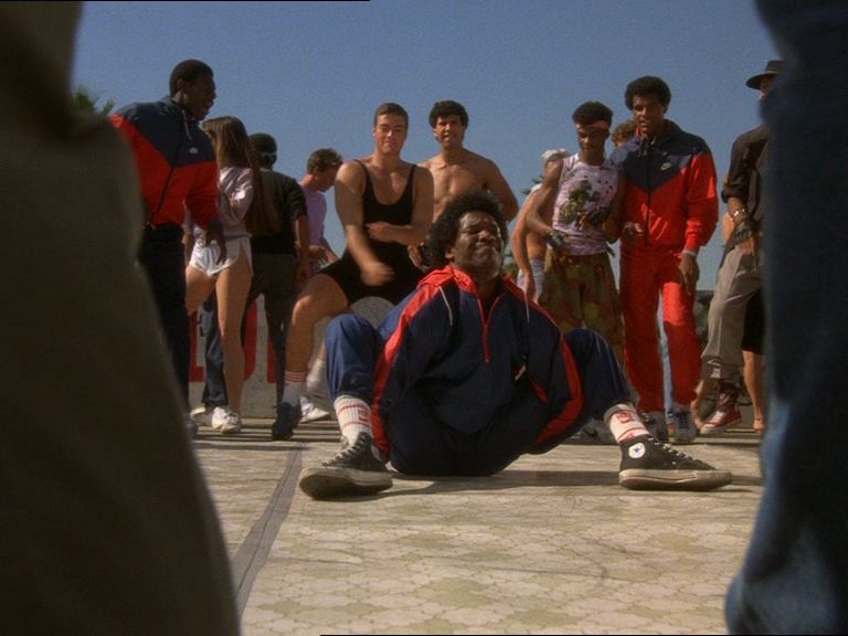 Scene from Breakin. JCVD is in the background dancing.