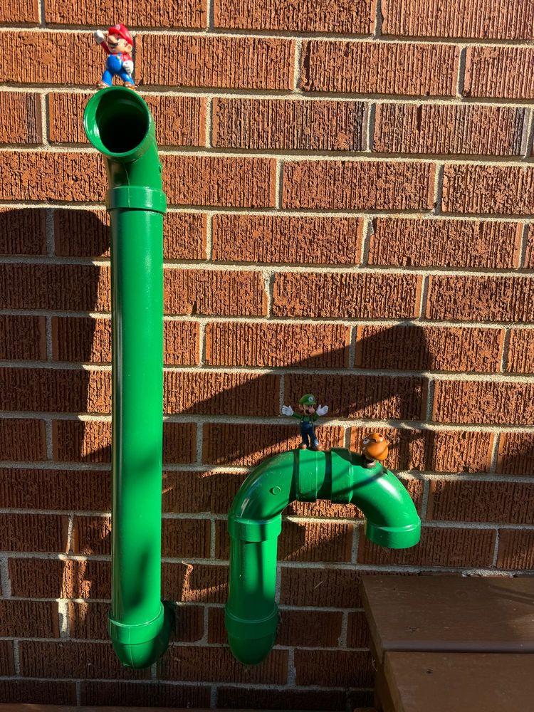 Furnace intake/exhaust pipes painted like Super Mario. 