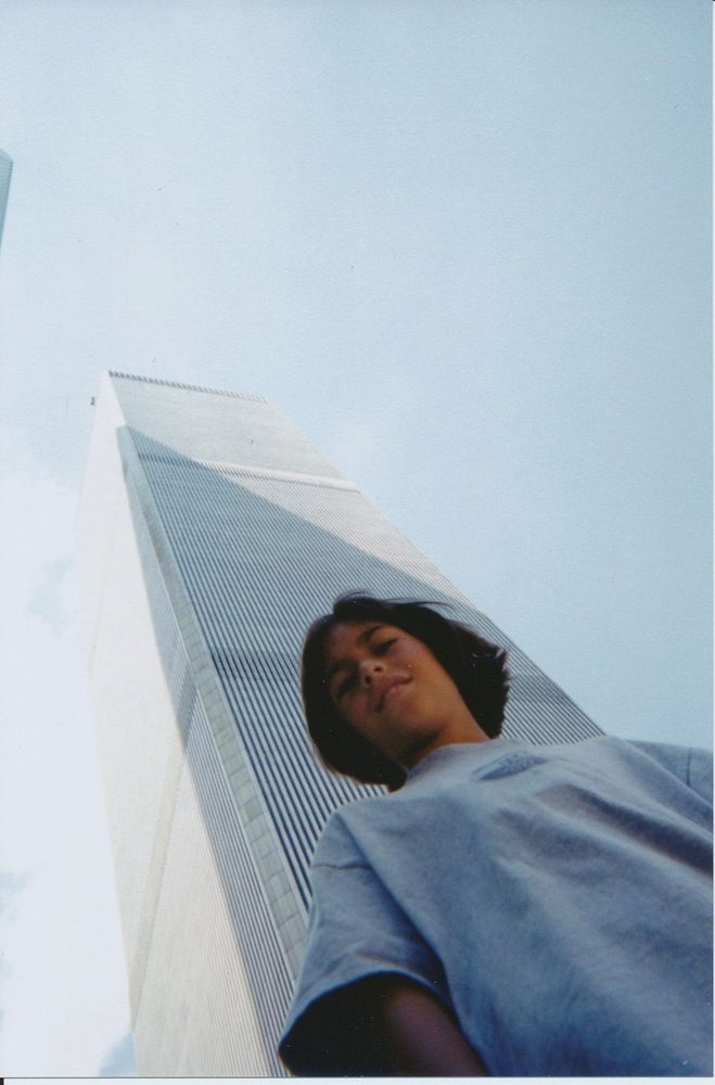 11yo Cass standing epically in front of one of the WTC towers I don't remember which one. The extreme canted angle is really "phat" and "dope" which is what we said instead of "epic" and "based" in the late 90s