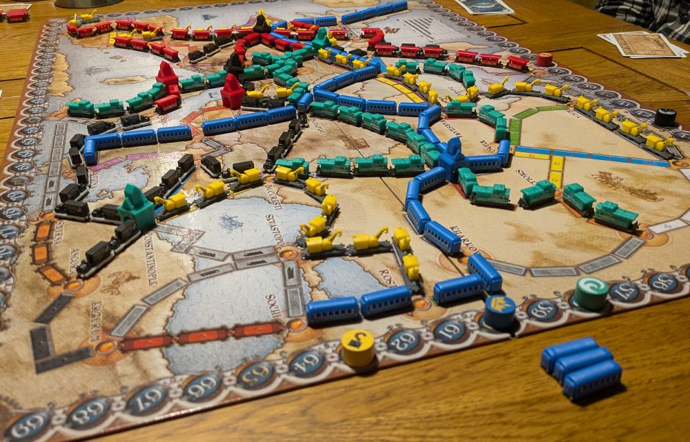 A complete game of the board game, Ticket To Ride Europe, using the new deluxe train carriage pieces.