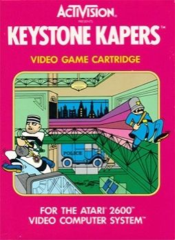 A video game over showing a cartoon drawing of a man in old fashioned prisoner outfit running to the left with a bag of money and jewelry.  A Keyrone Cop runs in the other direction. The cover reads "ACTAVISION KEYSTONE KAPERS VIDEO GAME CARTRIDGE FOR THE ATARI 2600 VIDEO COMPUTER SYSTEM."
