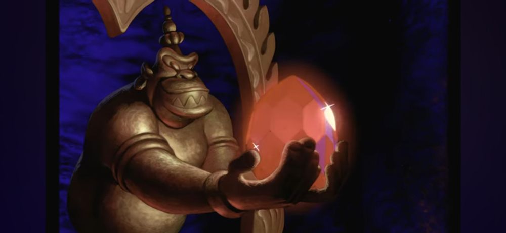 Großer roter Rubin in der Hand einer grauseligen Affenstatue