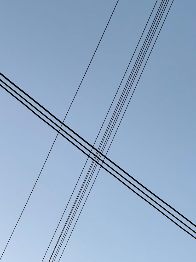 Power lines against sky, creating a nice pattern
