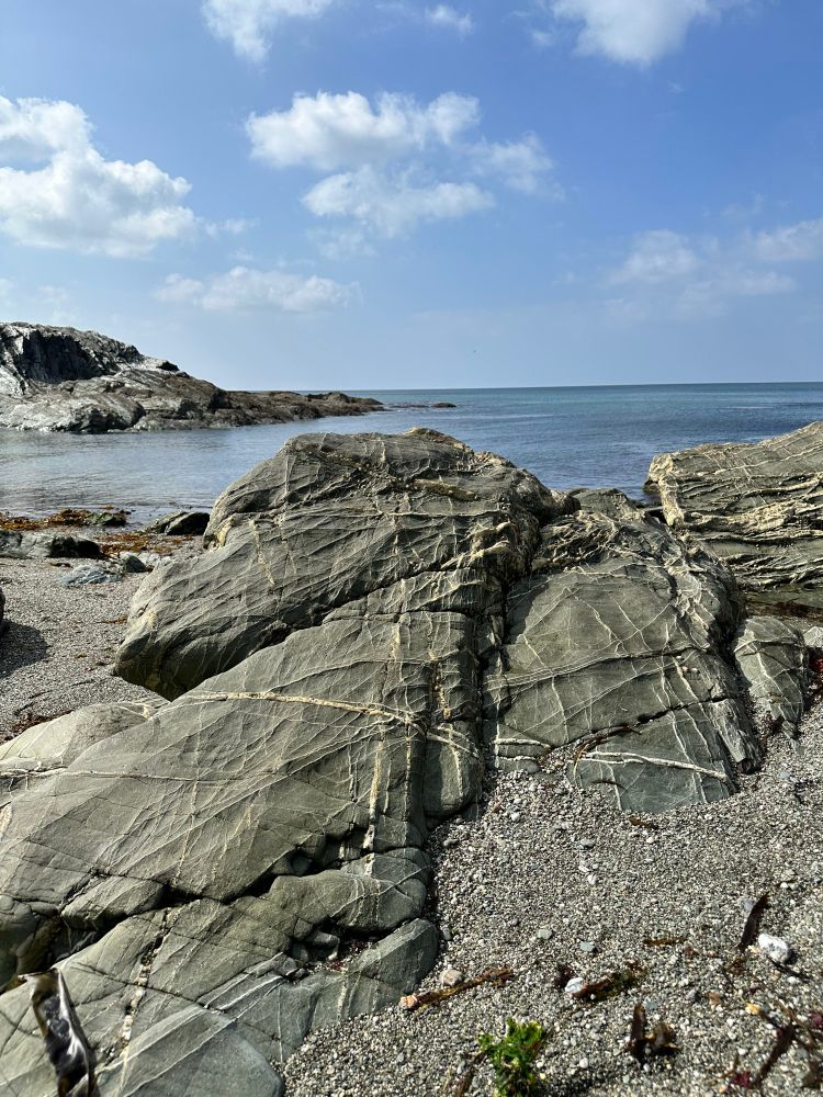 Rock on beach with weird lines