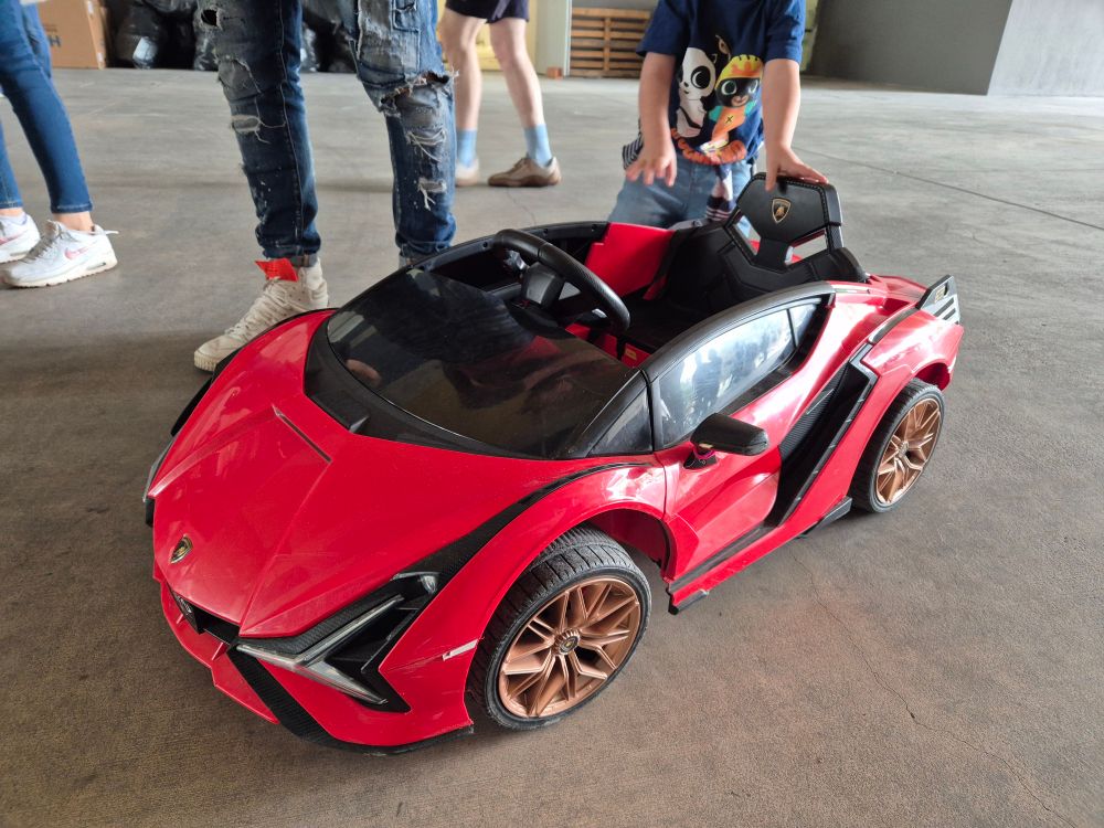 A child-sized red Lamborghini