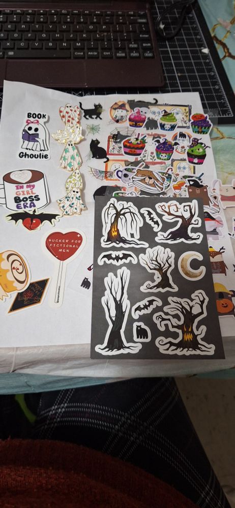Various stickers and some ghost enamel pins