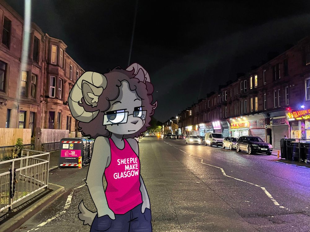 yr girl, yvette's fursona, a sheep wearing a "sheeple make glasgow" tank top, standing on paisley road west