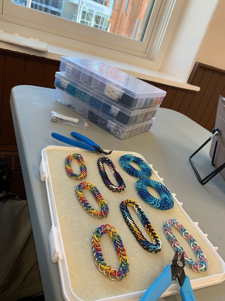 Some pride chainmail bracelets on my workboard