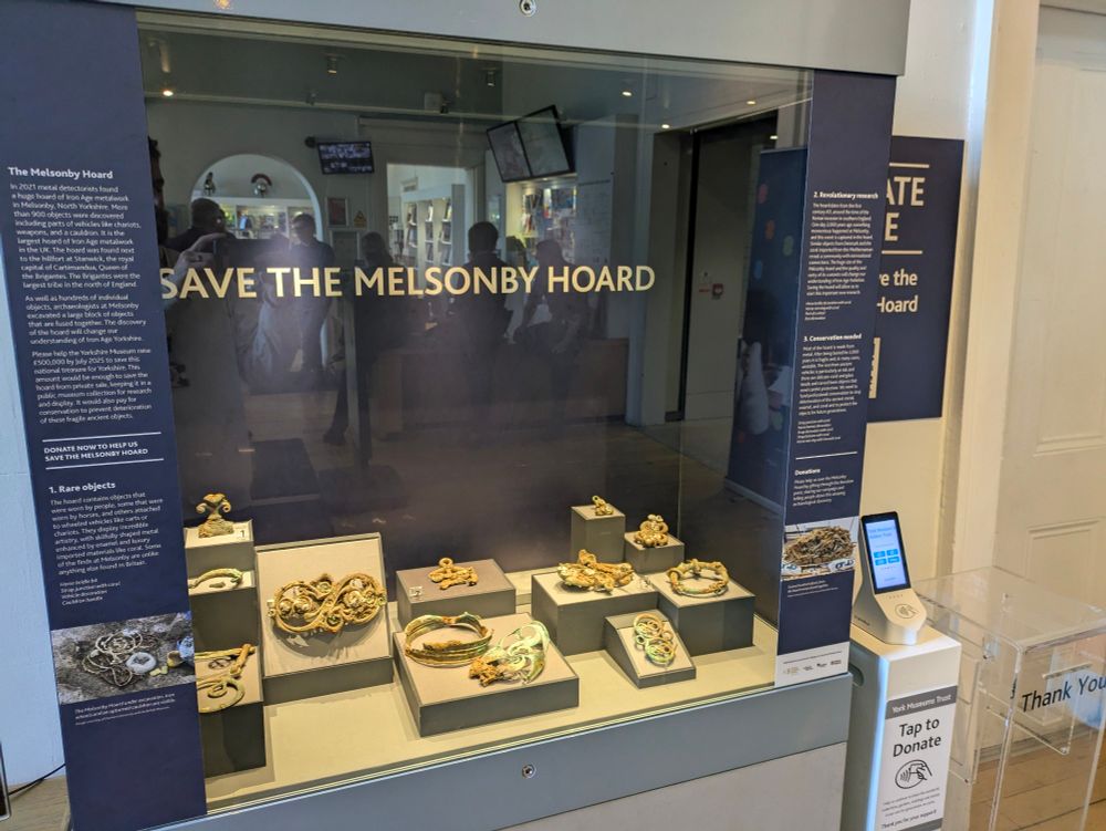 A museum display case titled Save the Melsonby Hoard