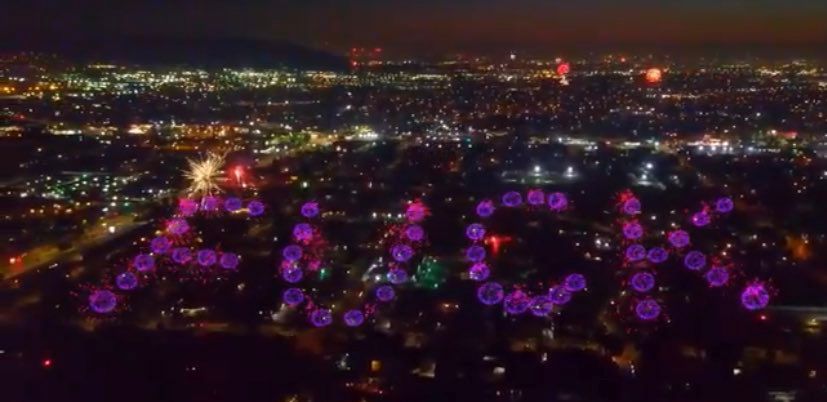 Purple fireworks over Los Angeles spelling out the word “FUCK”