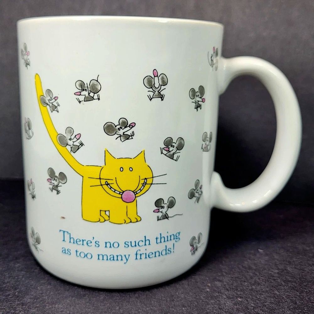 Mug depicting a yellow grinning cat surrounded by mice over the text "there's no such thing as too many friends". 