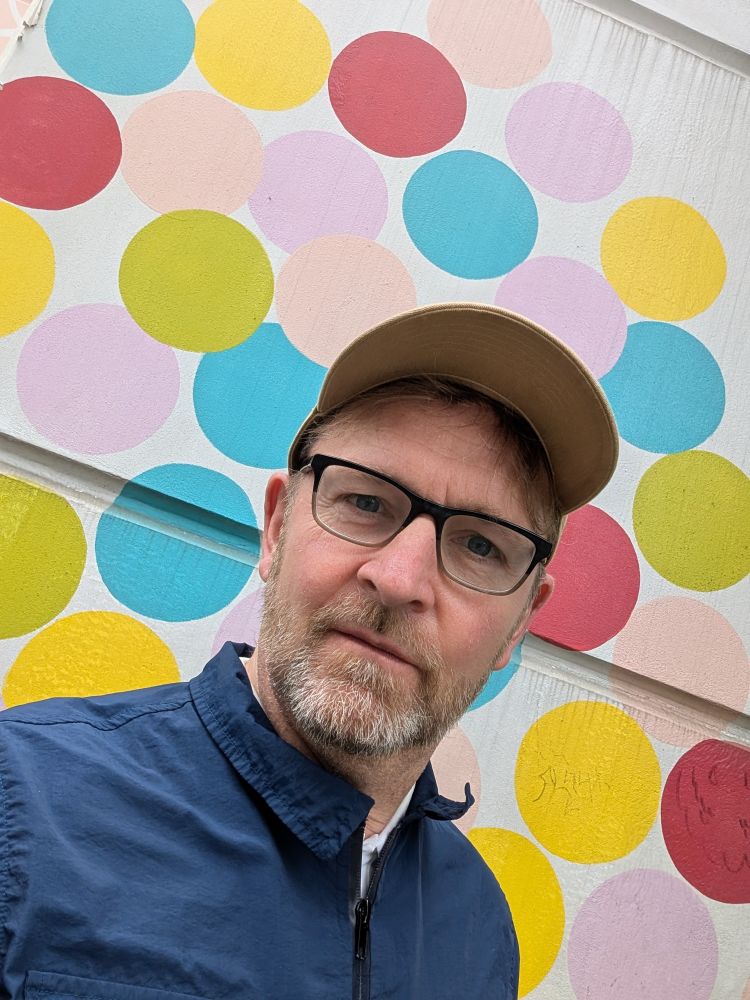 The raddled author in front of The Jealous Curator's mural in a #totzadorbz selfie 