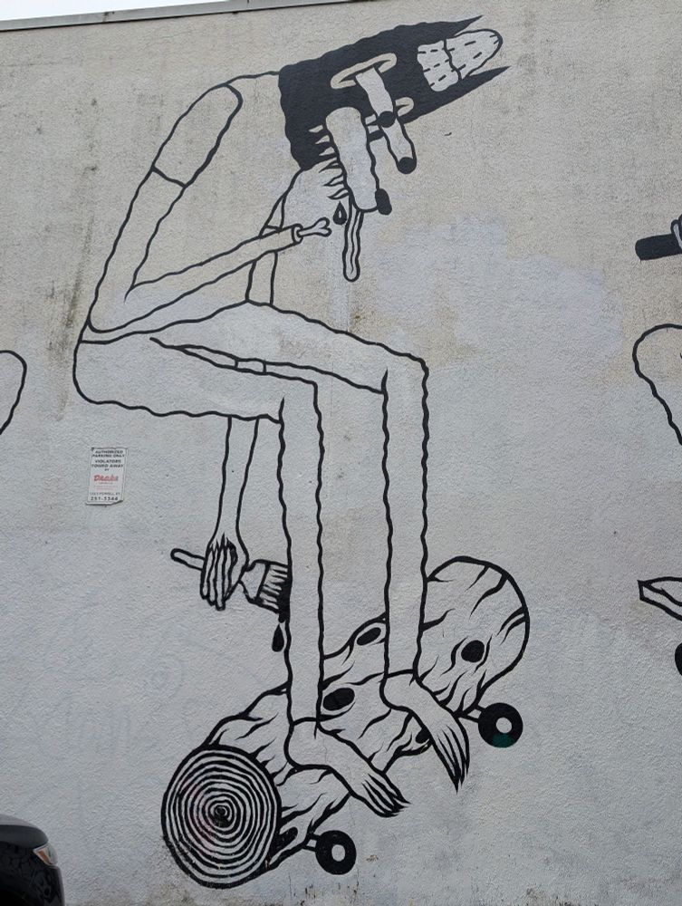 Detail from a mural by Spencer Kenton Cunningham showing a dope smoking wolf with his eyes pooping out skateboarding on a log.