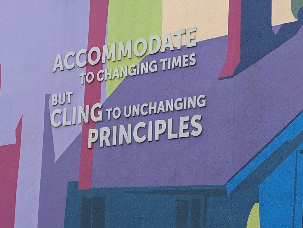 Detail from a mural by Kyle Scott at 33 East 8th Avenue Vancouver showing the quotation "Accommodate to changing times but cling to unchanging principles".