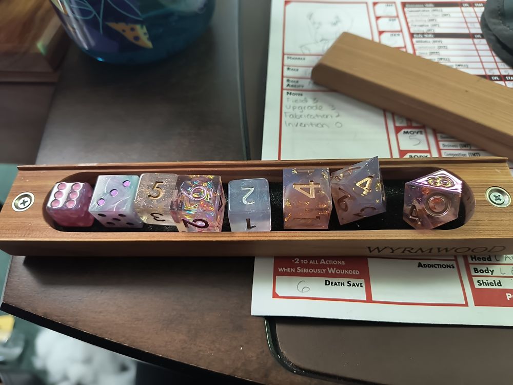 D6s and d10s with a pink pastel theme