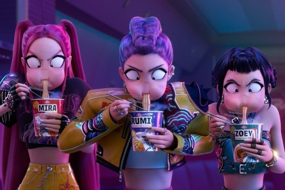 A shot from KPop Demon Hunters. The three main characters Mira, Rumi, & Zoey, carbo load on ramen before slaying demons through song (and edged weapons. Through song & edged weapons)