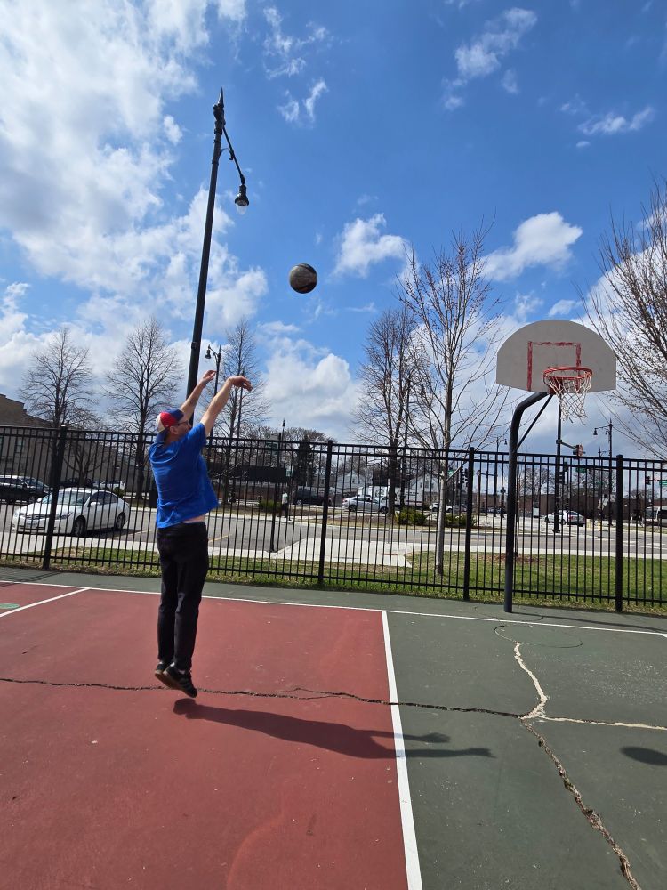 Josh Wilker shooting a jump shot in Roger's Park