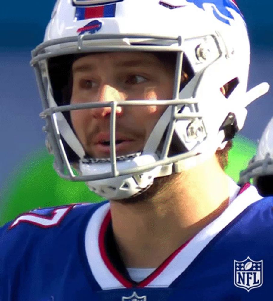 a football player wearing a helmet with the nfl logo on his chest