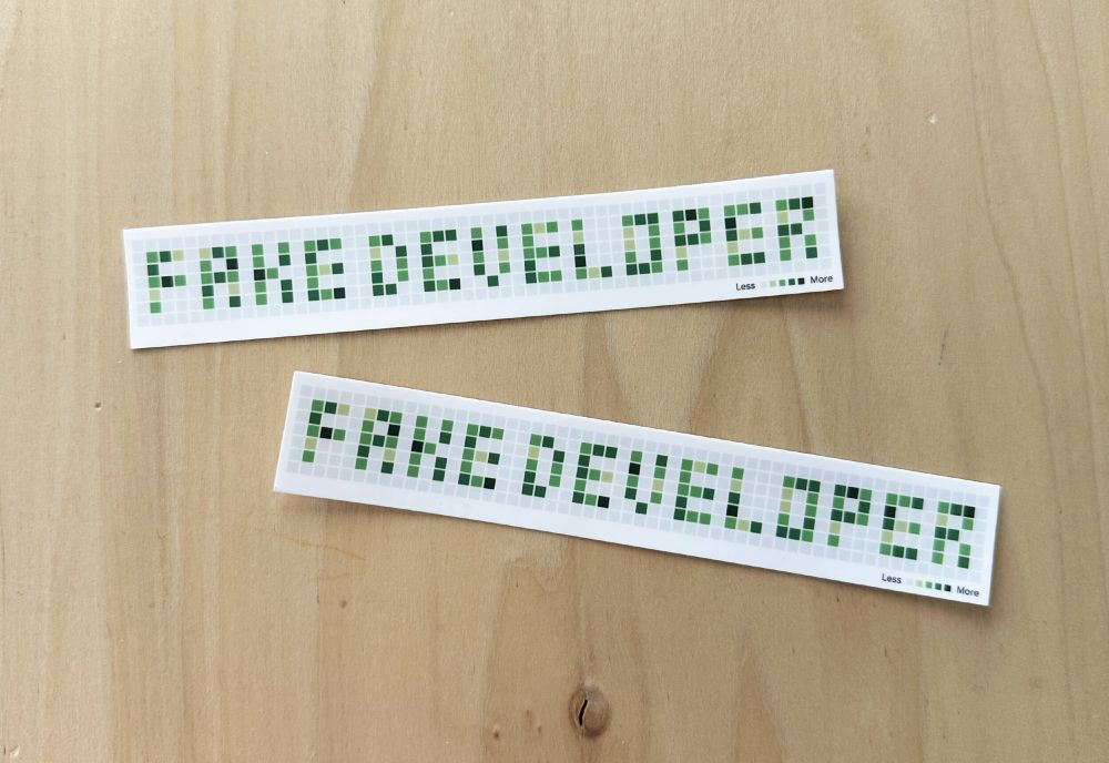 Two vinyl stickers, each 6"x1" on white background. Grey and green squares mimic the GitHub contribution graph. The green squares spell out "Fake Developer"