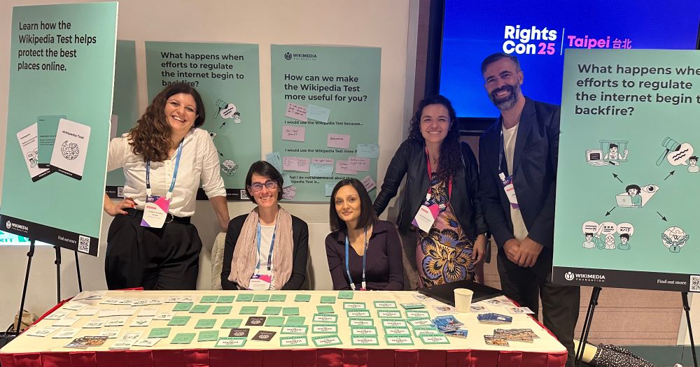 A photograph of Wikimedia Foundation staff piloting the "Wikipedia Test" at their both during RightsCon 2025 in Taipei, Taiwan