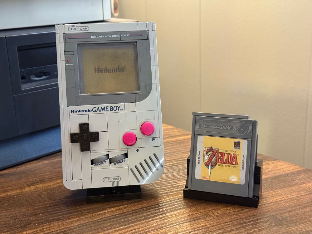 finished lego game boy and a cartridge on display stands