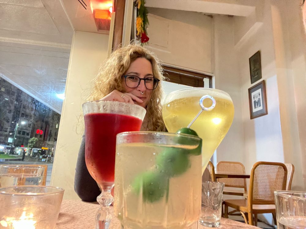 Stone cold hot babe that is bellofthebird behind a Violent Beauregard (Ruby), a Death in the Afternoon (gold), and the filthiest, I just fucked a priest, Martini (front).